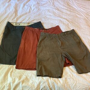 THREE pairs Men’s Volcom shorts size 32 in navy, dark gray and burgundy